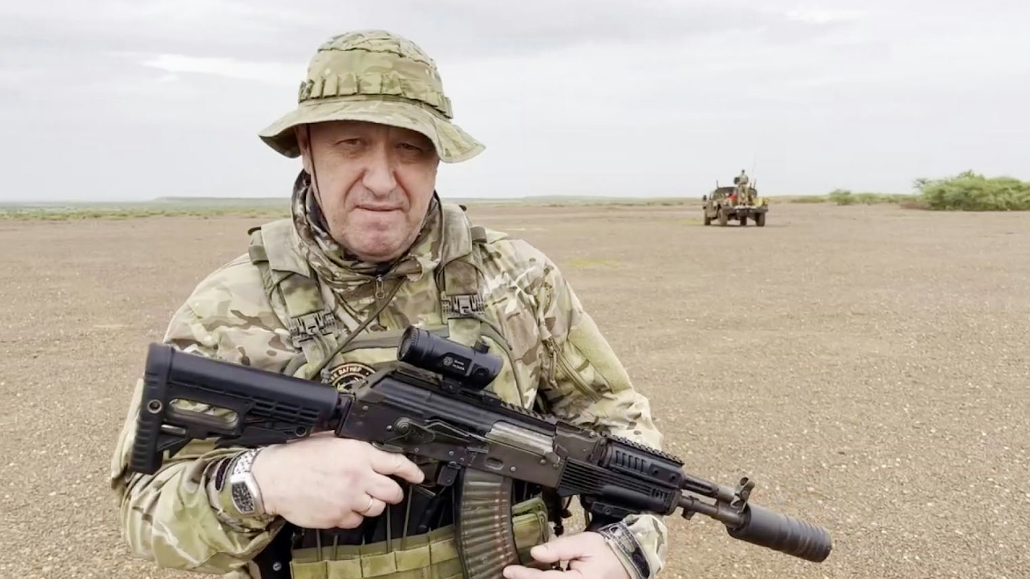 UNSPECIFIED LOCATION IN AFRICA - AUGUST 21: (----EDITORIAL USE ONLY - MANDATORY CREDIT - 'WAGNER TELEGRAM ACCOUNT / HANDOUT' - NO MARKETING NO ADVERTISING CAMPAIGNS - DISTRIBUTED AS A SERVICE TO CLIENTS----) A screen grab captured from a video shared online shows Yevgeny Prigozhin, the founder of the Russian private security company Wagner, holding a rifle in a desert area while wearing camouflage in a video for the first time after his rebellion against the Russian administration in an unspecified location in Africa on August 21, 2023. In the footage shared on the Telegram channel 'Wagner's evacuation', Prigozhin stated that they have made Russia 'even greater' on all continents, including Africa.