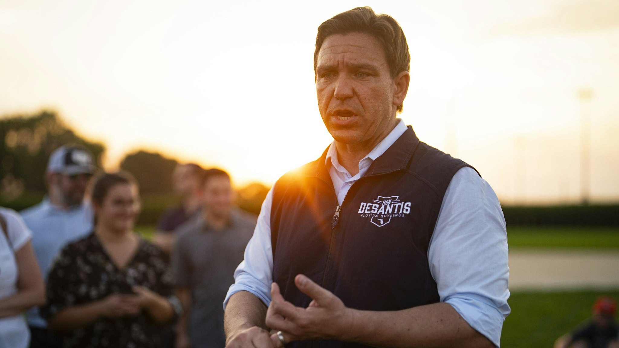 Ron DeSantis, governor of Florida and 2024 Republican presidential candidate, speaks with members of the media during a campaign stop at the Field of Dreams in Dyersville, Iowa, US, on Thursday, Aug. 24, 2023. Republican candidates this week battled each other over the economy in their first debate of the 2024 race, waging attacks on President Joe Biden's policies while seeking to gain ground on the absent GOP frontrunner Donald Trump.
