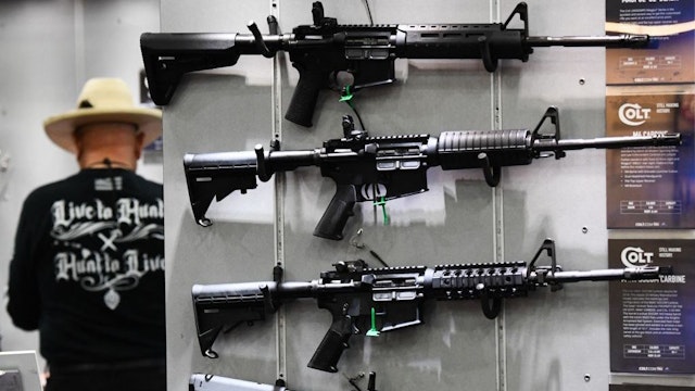Colt M4 Carbine and AR-15 style rifles are displayed during the National Rifle Association (NRA) Annual Meeting at the George R. Brown Convention Center, in Houston, Texas on May 28, 2022. - America's powerful National Rifle Association kicked off a major convention in Houston Friday, days after the horrific massacre of children at a Texas elementary school, but a string of high-profile no-shows underscored deep unease at the timing of the gun lobby event. (Photo by Patrick T. FALLON / AFP) (Photo by PATRICK T. FALLON/AFP via Getty Images)