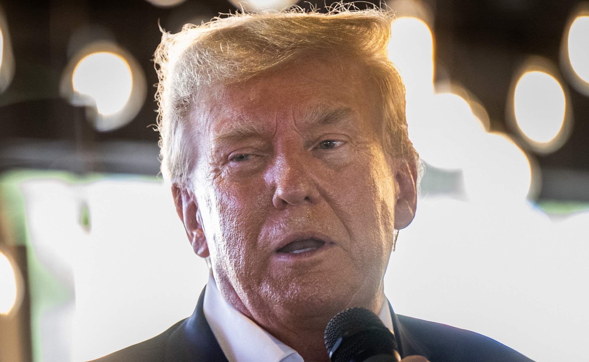 DES MOINES, IOWA - AUGUST 12: Republican presidential candidate and former U.S. President Donald Trump speaks during a rally at the Steer N' Stein bar at the Iowa State Fair on August 12, 2023 in Des Moines, Iowa. Republican and Democratic presidential hopefuls, including Florida Gov. Ron DeSantis, former President Donald Trump are visiting the fair, a tradition in one of the first states to hold caucuses in 2024.