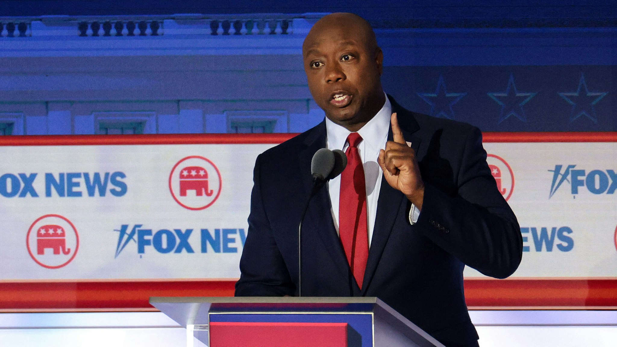 MILWAUKEE, WISCONSIN - AUGUST 23: Republican presidential candidate, U.S. Sen. Tim Scott (R-SC) speaks during the first debate of the GOP primary season hosted by FOX News at the Fiserv Forum on August 23, 2023 in Milwaukee, Wisconsin. Eight presidential hopefuls squared off in the first Republican debate as former U.S. President Donald Trump, currently facing indictments in four locations, declined to participate in the event.