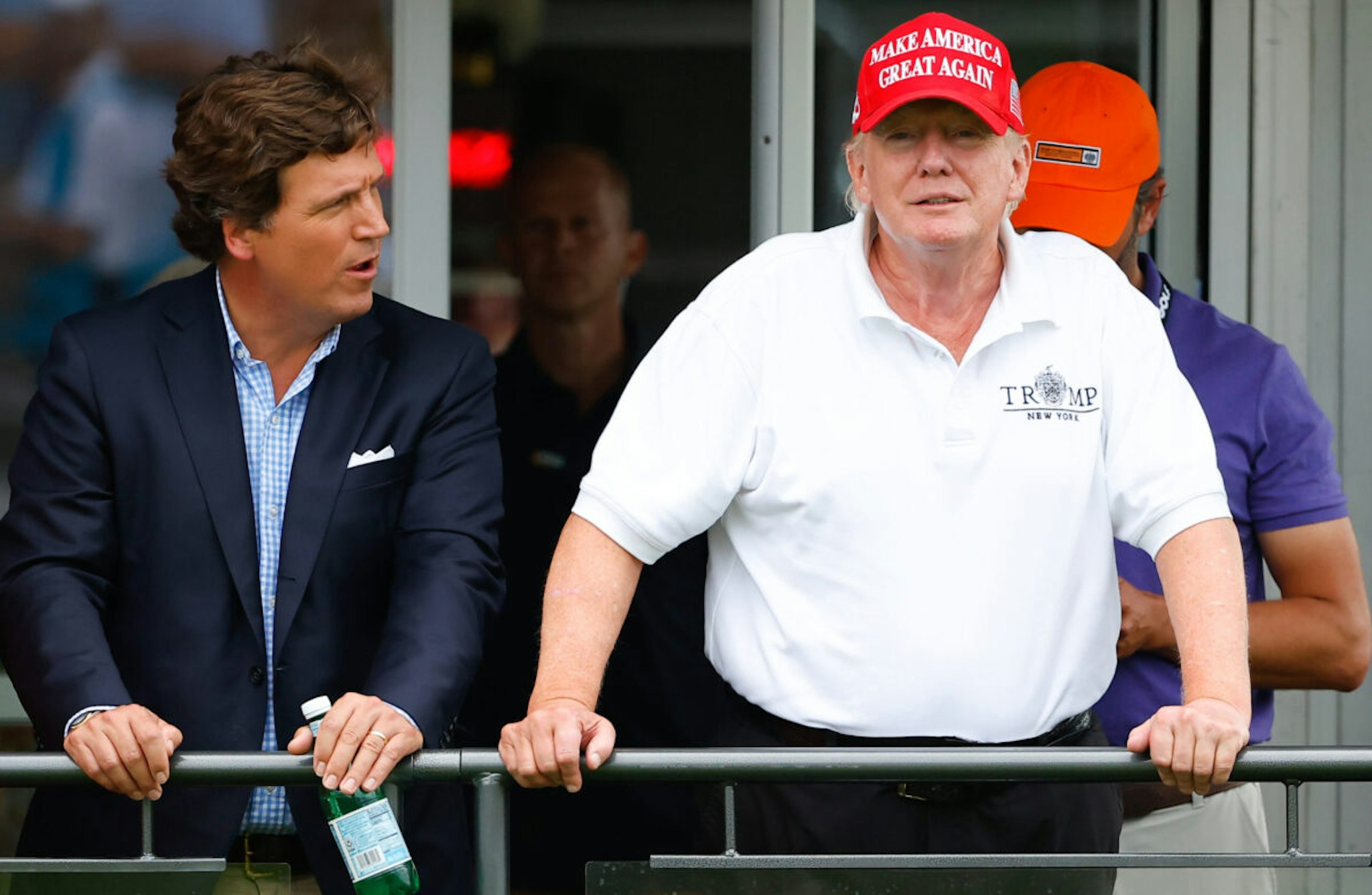 BEDMINSTER, NJ - JULY 31: Former President Donald Trump, Tucker Carlson and Marjorie Taylor Greene during the 3rd round of the LIV Golf Invitational Series Bedminster on July 31, 2022 at Trump National Golf Club in Bedminster, New Jersey.