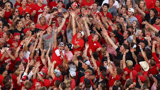 Fans reach for a volleyball thrown by a Nebraska Cornhusker during player introductions before the game between the Nebraska Cornhuskers and the Omaha Mavericks during Nebraska Volleyball Day at Memorial Stadium on August 30, 2023 in Lincoln, Nebraska.