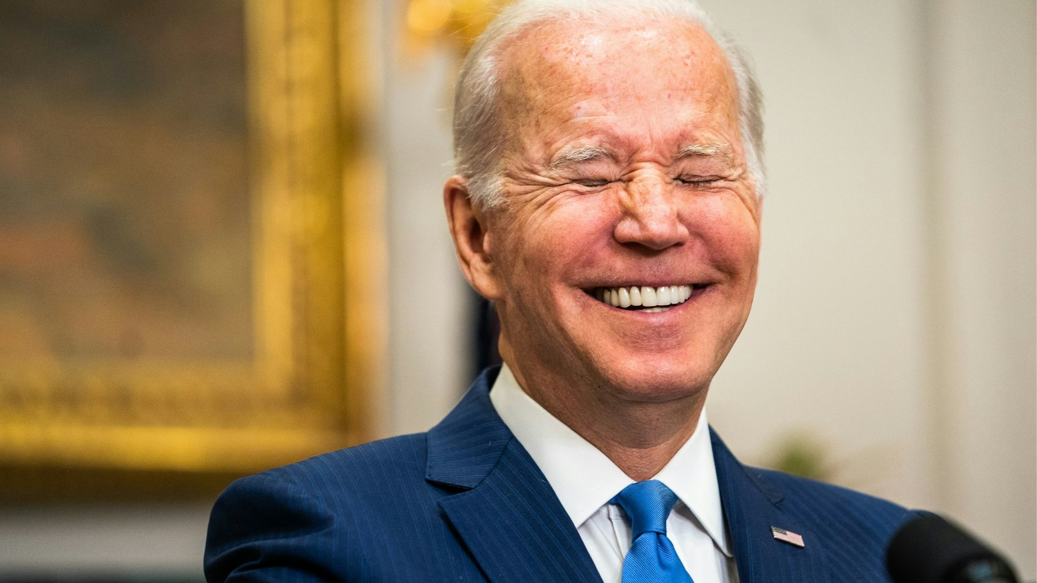WASHINGTON, DC April 28, 2022: President Joe Biden laugh during questioning in the Roosevelt Room of The White House on Thursday April 28, 2022.