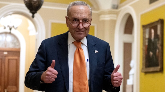 TOPSHOT - US Senate Majority Leader Chuck Schumer (D-NY) gives a thumbs up after voting on the continuing resolution passed by the House earlier in the day on Capitol Hill in Washington, DC on September 30, 2023. Last-ditch moves to prevent a US government shutdown took a dramatic step forward September 30, 2023, as Democrats overwhelmingly backed an eleventh-hour Republican measure to keep federal funding going for 45 days, albeit with a freeze on aid to Ukraine.