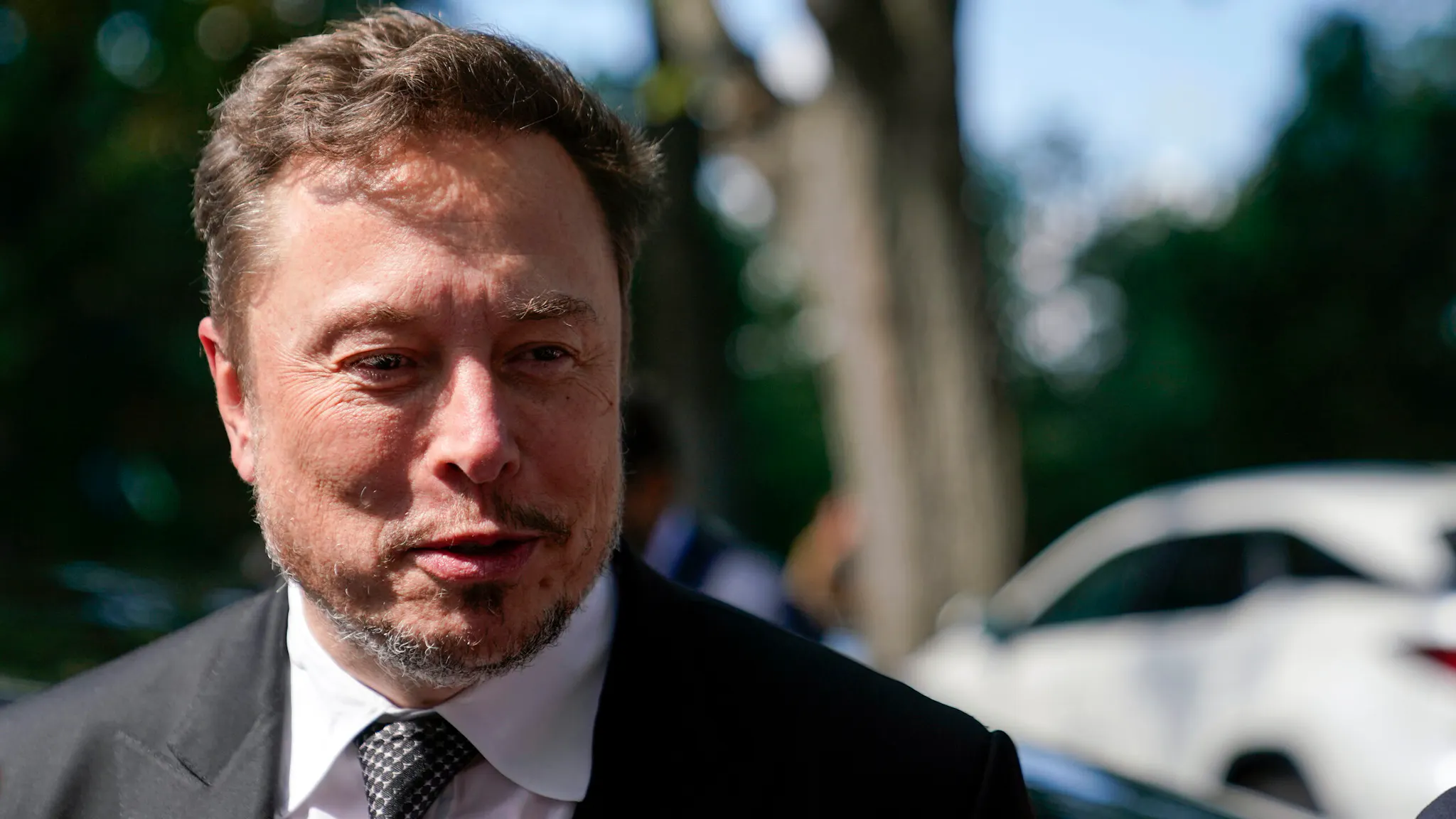 Tech CEOs Attend Sen. Schumer’s Senate AI Forum WASHINGTON, DC - SEPTEMBER 13: Elon Musk, CEO of Tesla and X, speaks to reporters as he leaves the “AI Insight Forum” at the Russell Senate Office Building on Capitol Hill on September 13, 2023 in Washington, DC. Lawmakers are seeking input from business leaders in the artificial intelligence sector, and some of their most ardent opponents, for writing legislation governing the rapidly evolving technology.