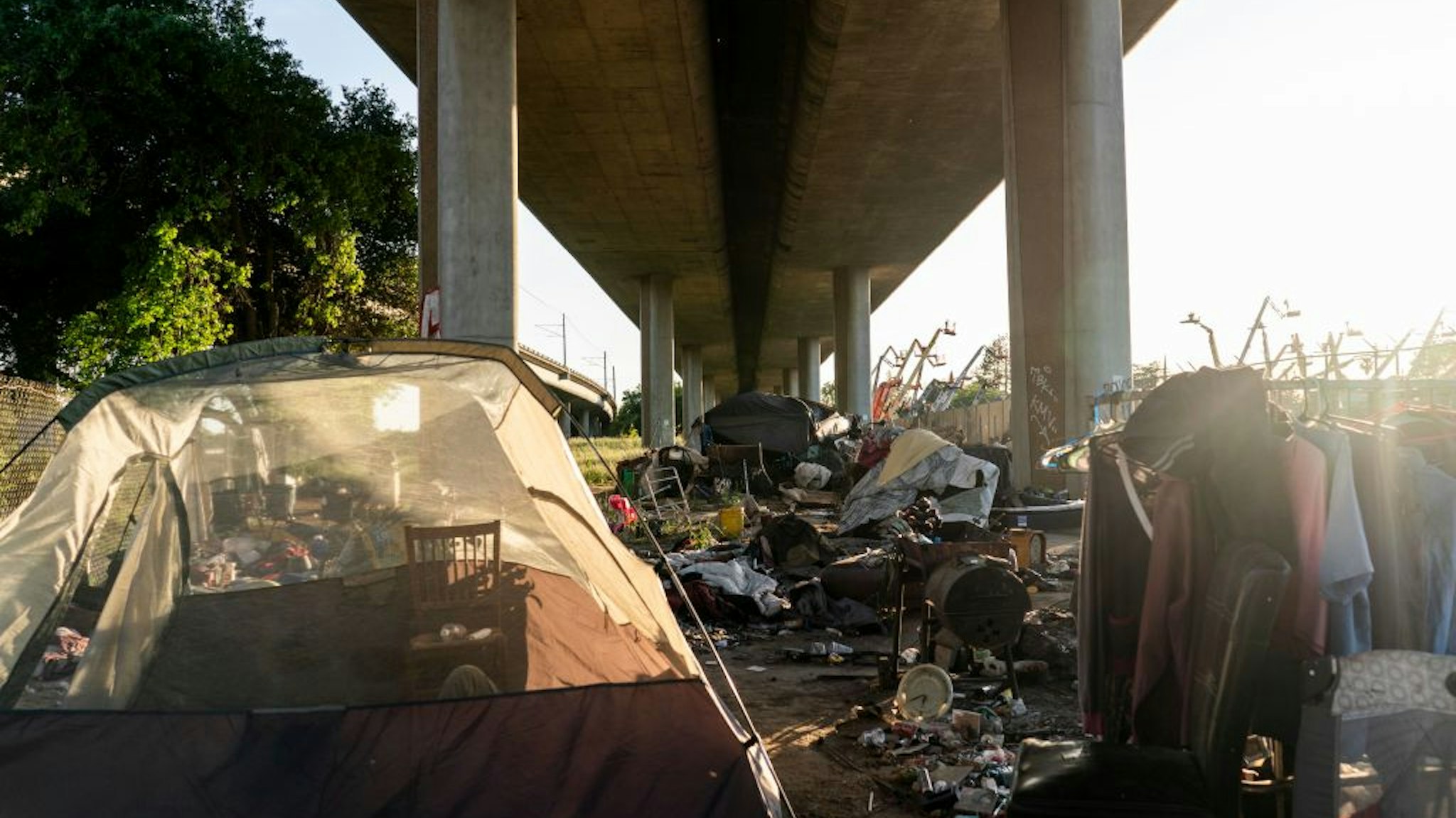 SACRAMENTO, CALIFORNIA - MARCH 30, 2022: Homeless encampments of tents hidden underneath Route I-80 along Roseville Road in Sacramento, California Wednesday March 30, 2022. (Melina Mara/The Washington Post via Getty Images)