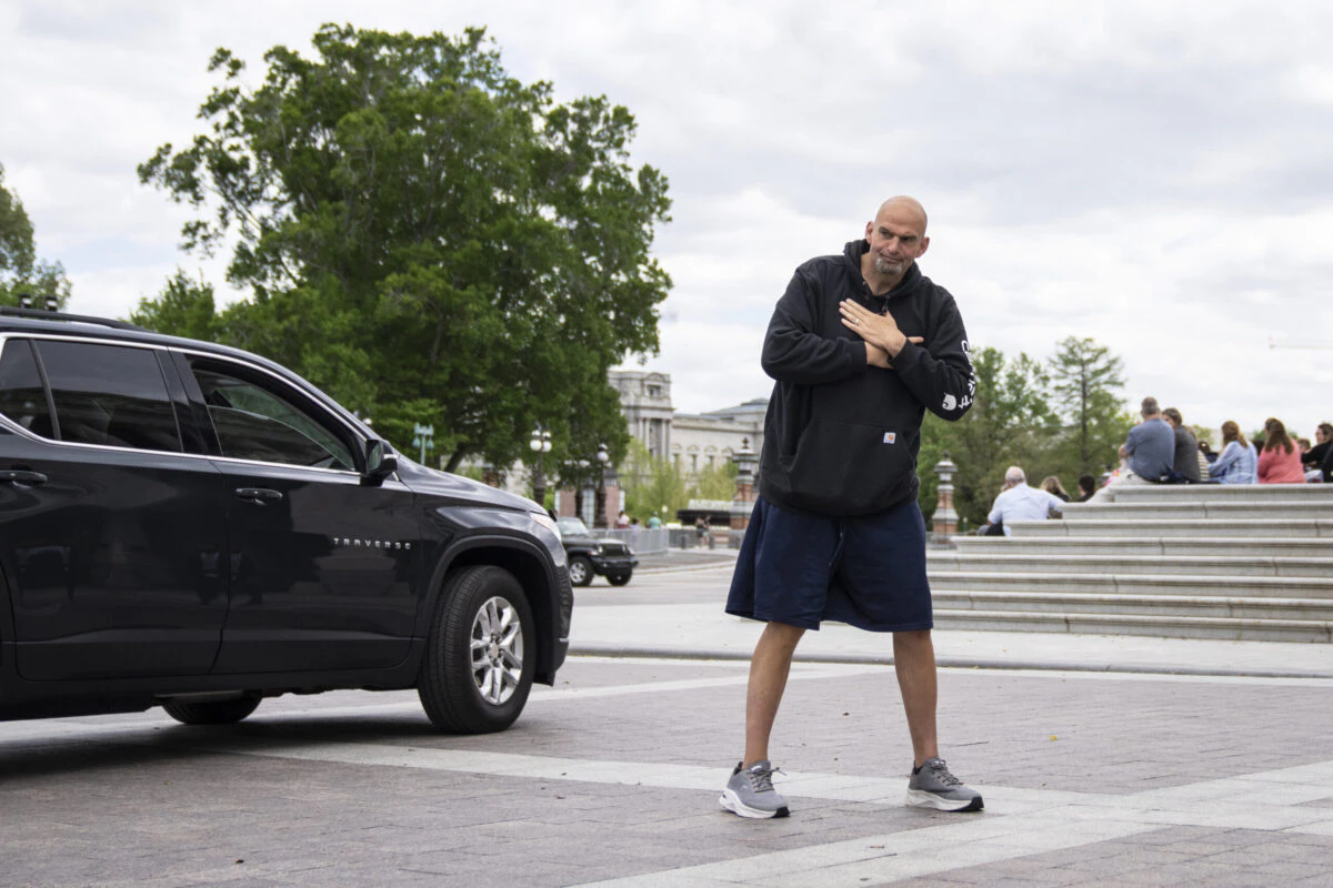 U.S. Sen. John Fetterman (D-PA) gestures to reporters as he arrives at the U.S. Capitol on April 17, 2023 in Washington, DC. Fetterman is returning to the Senate following six weeks of treatment for clinical depression.