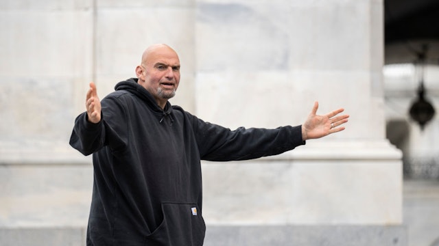WASHINGTON, DC - APRIL 17: U.S. Sen. John Fetterman (D-PA) gestures to reporters as he arrives at the U.S. Capitol on April 17, 2023 in Washington, DC. Fetterman is returning to the Senate following six weeks of treatment for clinical depression. (Photo by Drew Angerer/Getty Images)