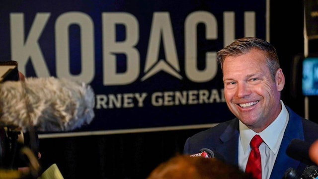 Kris Kobach, the Republican candidate for Kansas attorney general, talks to the media before an election night watch party on Nov. 8, 2022, in Topeka, Kansas.