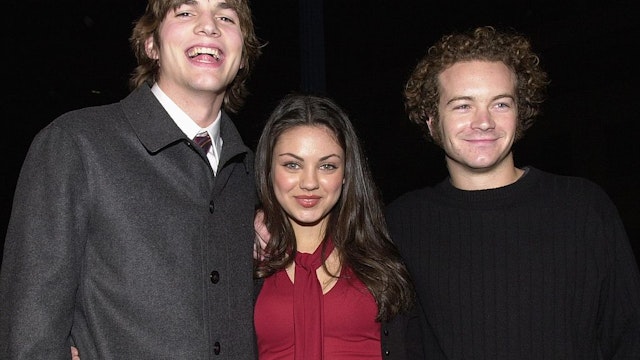 383262 34: From left to right, "That 70''s Show" cast members Ashton Kutcher, Mila Kunis, and Danny Masterson arrive at the premiere of USA Films'' "Traffic" December 14, 2000 at the Academy of Motion Pictures Arts and Sciences Theatre in Beverly Hills, CA. (Photo by Chris Weeks/Liaison)