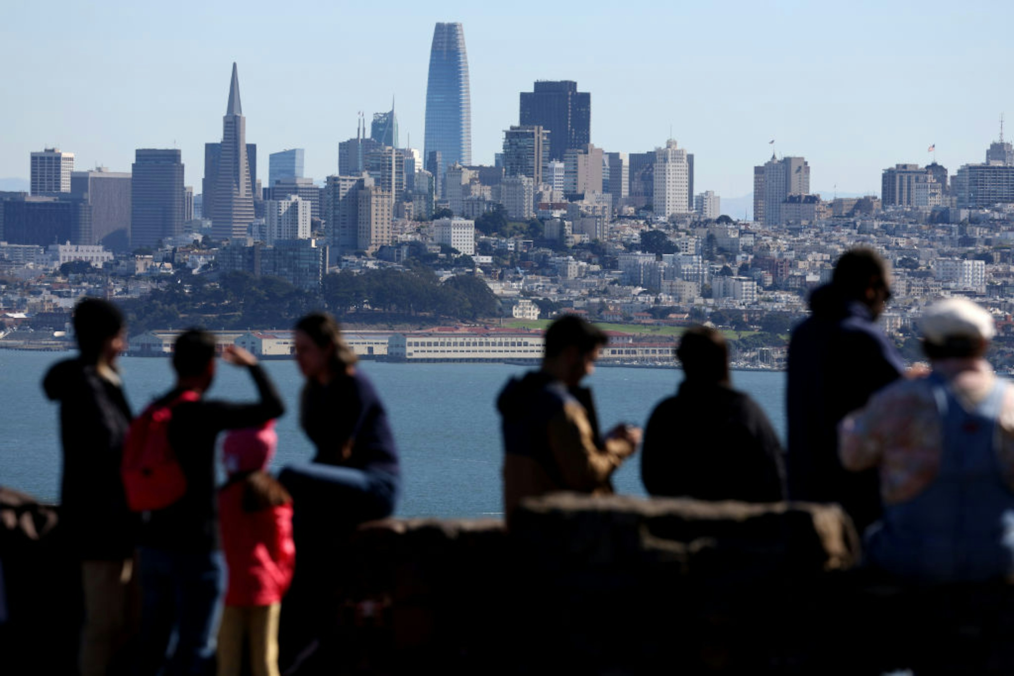 SAUSALITO, CALIFORNIA - OCTOBER 24: Visitors look at the San Francisco skyline from a vista point on October 24, 2022 in Sausalito, California. The State of California, currently the fifth largest economy in the world, is likely to overtake Germany as the fourth largest economy in the near future as the state's gross domestic product is continuing to rise with steady growth. (Photo by Justin Sullivan/Getty Images)