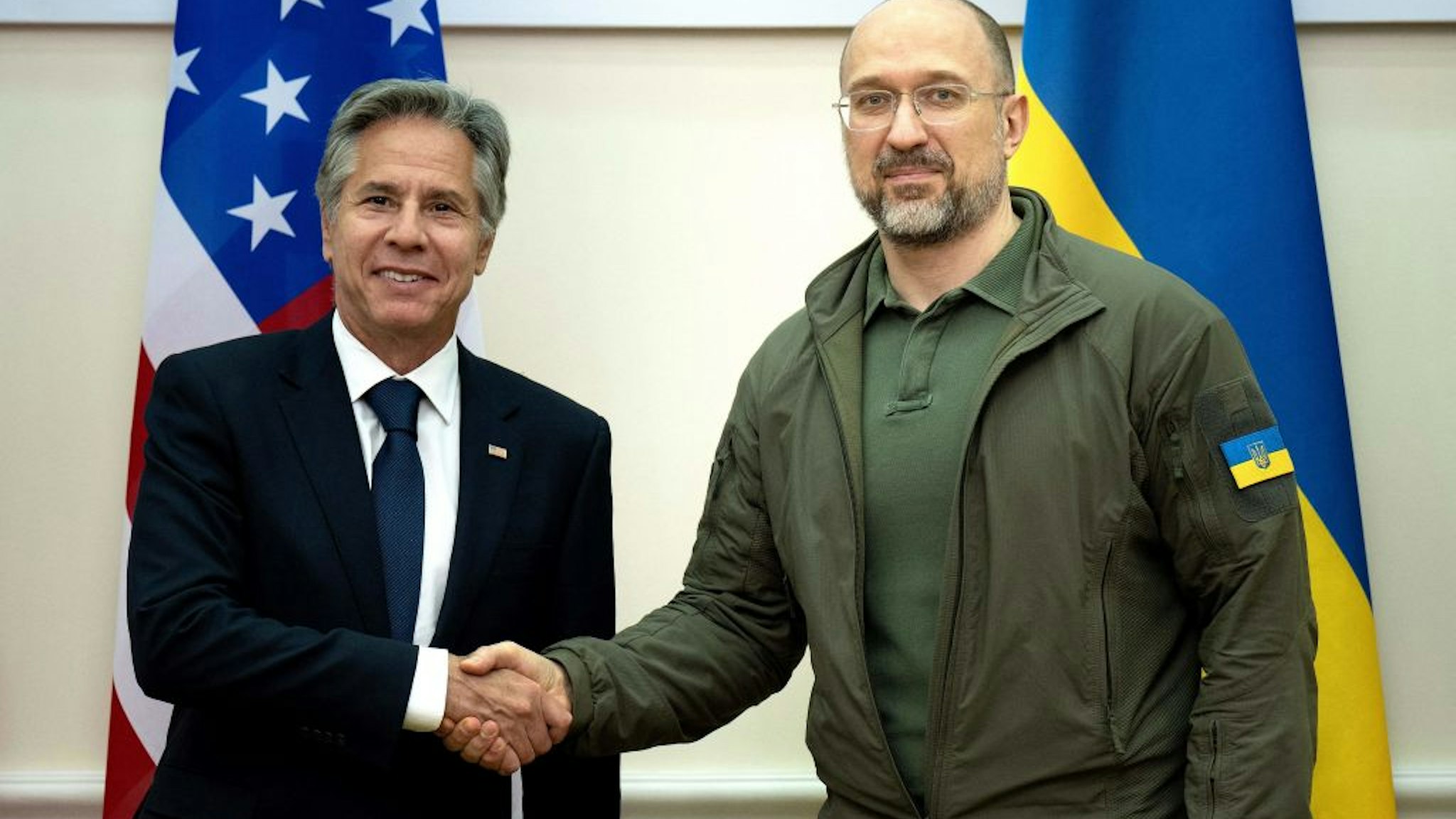 US Secretary of State Antony Blinken and Ukraine's Prime Minister Denys Shmyhal shake hands prior to their meeting at the Prime Minister's Office in Kyiv on September 6, 2023. US Secretary of State Antony Blinken arrived in Kyiv on an unannounced visit on September 6, 2023, where he was due to announce more than a billion dollars in fresh aid to Ukraine. Blinken's visit -- his fourth during Moscow's assault -- comes as Kyiv has touted some successes this week in its offensive to push back Russian forces. (Photo by Brendan Smialowski / POOL / AFP)