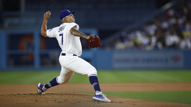 Julio Urias #7 of the Los Angeles Dodgers throws against the Atlanta Braves in the first inning at Dodger Stadium on September 01, 2023 in Los Angeles, California.