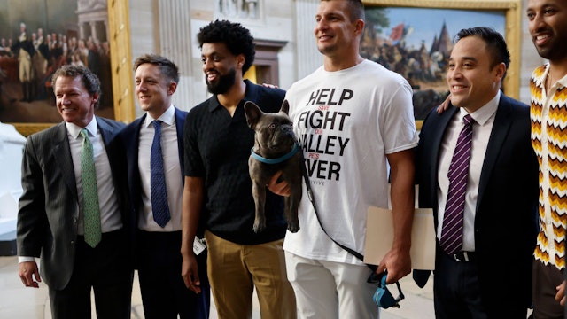 WASHINGTON, DC - SEPTEMBER 12: Four-time NFL Super Bowl champion Rob Gronkowski poses for photographs with his French bulldog Ralphie in the Rotunda of the U.S. Capitol before a meeting in Speaker Kevin McCarthy's office on September 12, 2023 in Washington, DC. Gronkowski was on Capitol Hill to meet with lawmakers on behalf of Anivive, a veterinary pharmaceutical company working on a vaccine for Valley Fever, a fungal infection that affects dogs and is caused by the fungus Coccidioides, which is found in the southwestern U.S. and northwestern Mexico. (Photo by Chip Somodevilla/Getty Images)