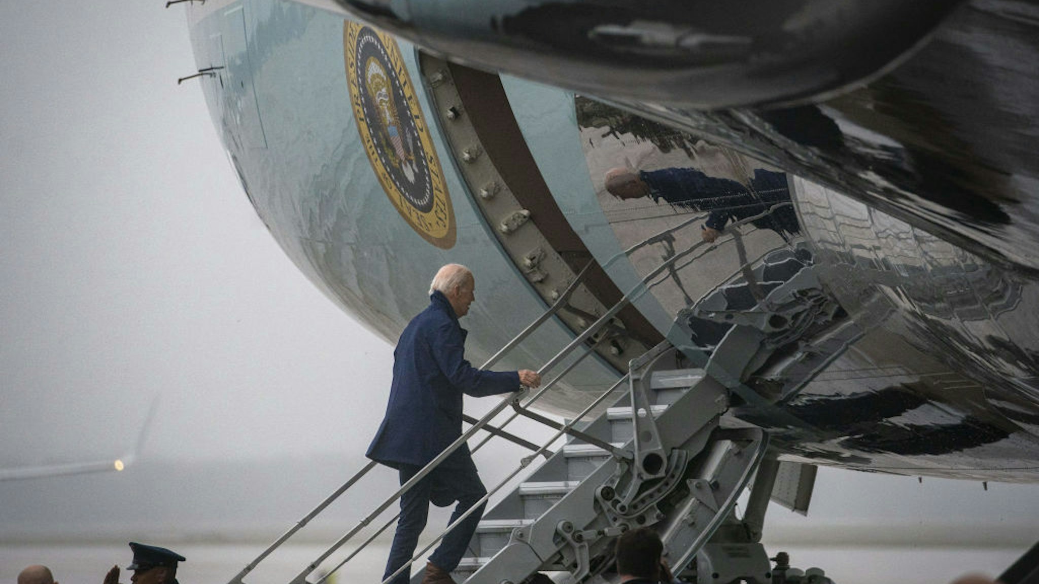 US President Joe Biden boards Air Force One at Joint Base Andrews, Maryland, US, on Tuesday, Sept. 26, 2023. Biden, who calls himself the most pro-union president in history, is traveling to Wayne County to join striking UAW members on the picket line. Photographer: Al Drago/Bloomberg via Getty Images