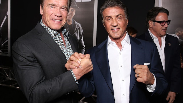 WESTWOOD, CA - NOVEMBER 19: Arnold Schwarzenegger (L) and Producer Sylvester Stallone attend the premiere of Warner Bros. Pictures' "Creed" at Regency Village Theatre on November 19, 2015 in Westwood, California. (Photo by Todd Williamson/Getty Images)