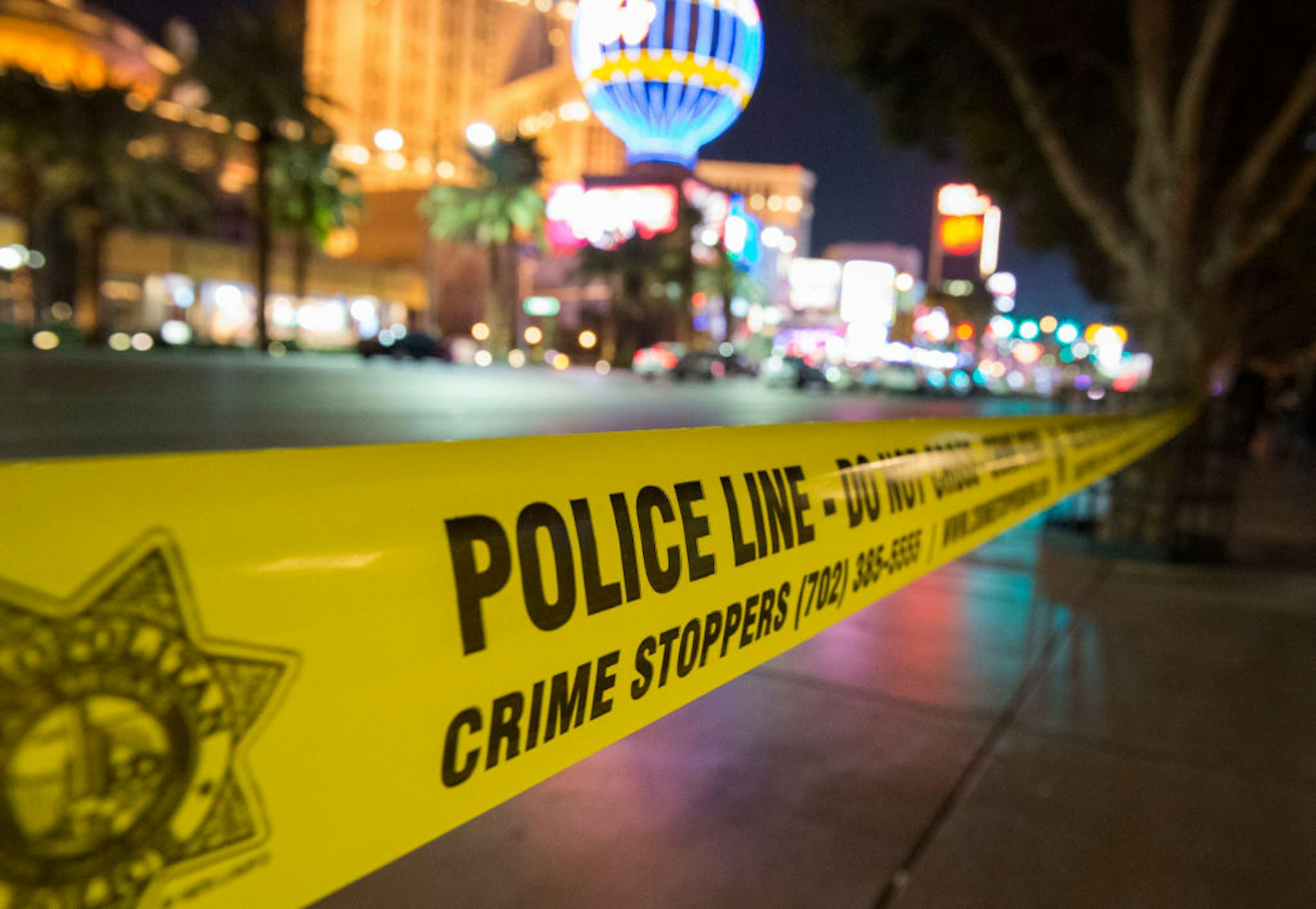 A police line blocks off part of the Las Vegas Strip after a car ran into a group of pedestrians between Planet Hollywood, where the Miss Universe pageant took place, and the Paris Las Vegas Hotel in Las Vegas, Nevada, on December 20, 2015. At least one person has died and more than 37 have been hurt after a car ran into a group of pedestrians on the bustling Las Vegas Strip on December 20, police said, adding the driver was in custody. AFP PHOTO / VALERIE MACON (Photo by Valerie MACON / AFP) (Photo credit should read VALERIE MACON/AFP via Getty Images)