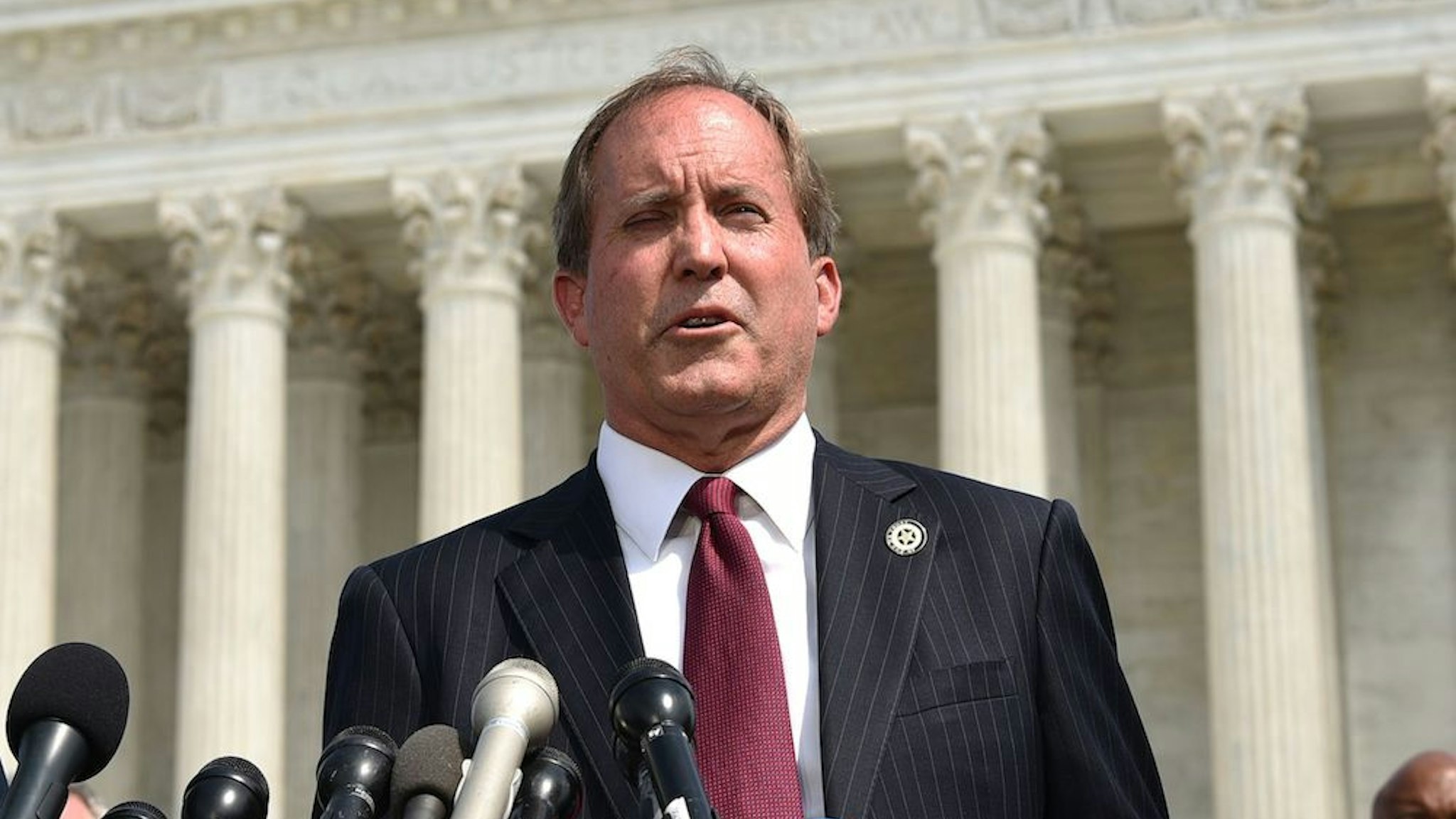 District of Columbia Attorney General Karl Racine (L) and Texas Attorney General Ken Paxton speak during the launch of an antitrust investigation into large tech companies outside of the US Supreme Court in Washington, DC on September 9, 2019. - The backlash against Big Tech heads into a new phase Monday with another broad antitrust investigation, highlighting the mounting legal challenges facing the dominant online platforms. Top legal officials from dozens of US states were set to unveil a probe of Google over allegations of "anticompetitive behavior," days after a separate coalition announced a similar investigation of social networking giant Facebook. (Photo by MANDEL NGAN / AFP) (Photo by MANDEL NGAN/AFP via Getty Images)