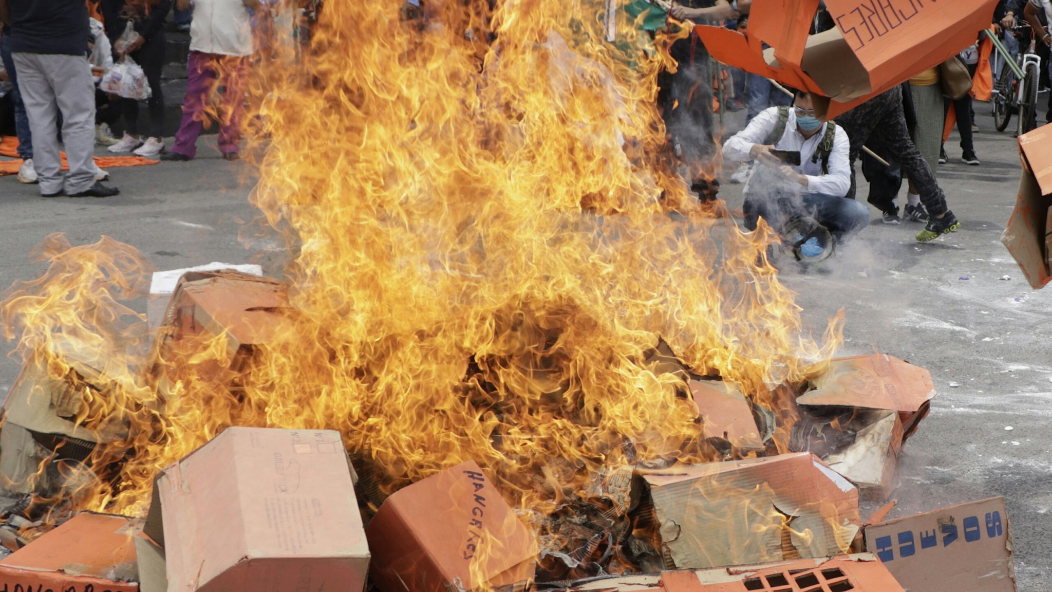 Protesters set fire to cardboard boxes simulating houses of the Housing Institute of the capital, to demand justice and attention to people who were allegedly defrauded by shell companies and local authorities to process a loan for housing in the Hangares area through this institute. On September 10, 2020 in Mexico City, Mexico.