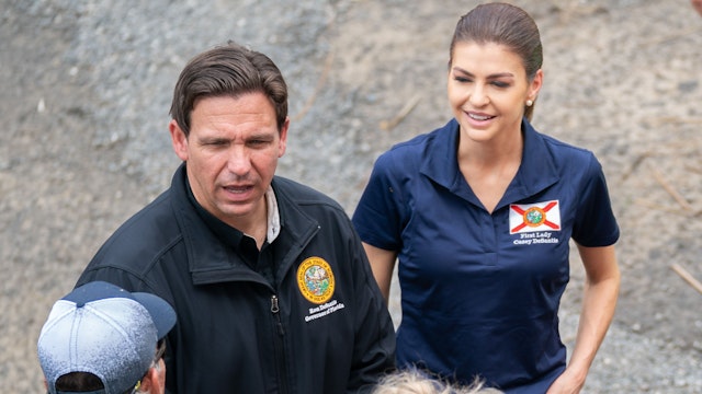 STEINHATCHEE, FLORIDA - AUGUST 31: Florida Gov. Ron DeSantis, second from left, talks with local business owners before a press conference in the aftermath of Hurricane Idalia on August 31, 2023 in Steinhatchee, Florida. Idalia, which weakened to a tropical storm made landfall at Keaton Beach, Florida as a category 3 hurricane and caused heavy rain and flash flooding.