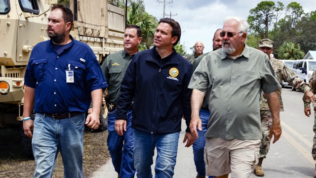 Ron DeSantis, governor of Florida and 2024 Republican presidential candidate, center, during a visit after Hurricane Idalia in Horseshoe Beach, Florida, US, on Thursday, Aug. 31, 2023. Florida has started to dig out from the aftermath of Idalia, which weakened to a tropical storm even as it brought heavy rain across Georgia and the Carolinas, caused billions of dollars in damage, left hundreds of flights grounded and thousands without power.