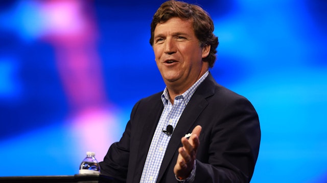 WEST PALM BEACH, FLORIDA - JULY 15: Tucker Carlson speaks at the Turning Point Action conference on July 15, 2023 in West Palm Beach, Florida. Trump is scheduled to speak at the event held in the Palm Beach County Convention Center.