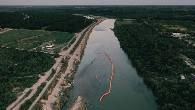 A string of buoys used as a border barrier on the Rio Grande River in Eagle Pass, Texas, US, on Thursday, July 13, 2023. Texas started deploying a new floating barrier on the Rio Grande as a way to deter migrant crossings at the US-Mexico border.