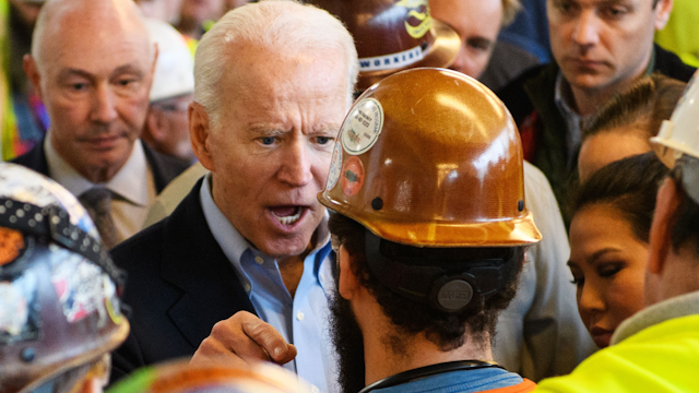 TOPSHOT - Democratic presidential candidate Joe Biden has heated exchange meets workers and discusses gun rights as he tours the Fiat Chrysler plant in Detroit, Michigan on March 10, 2020.