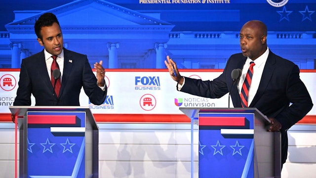 Entrepreneur Vivek Ramaswamy and US Senator from South Carolina Tim Scott speak during the second Republican presidential primary debate at the Ronald Reagan Presidential Library in Simi Valley, California, on September 27, 2023.