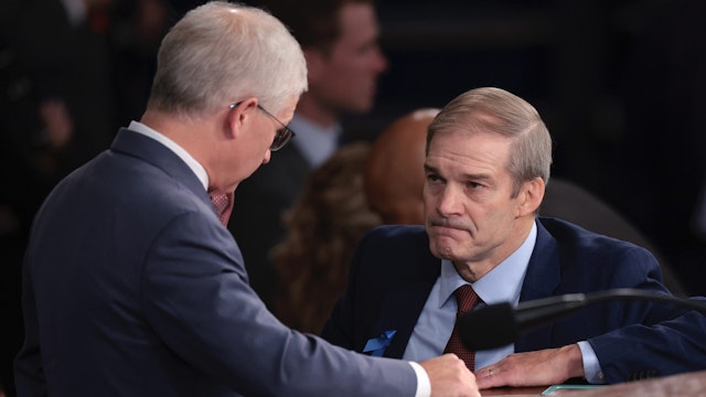 Rep. Jim Jordan (R-OH) (R) talks to Speaker Pro Tempore Rep. Patrick McHenry (R-NC) as the House of Representatives prepares to hold a vote on a new Speaker of the House at the U.S. Capitol on October 18, 2023 in Washington, DC.