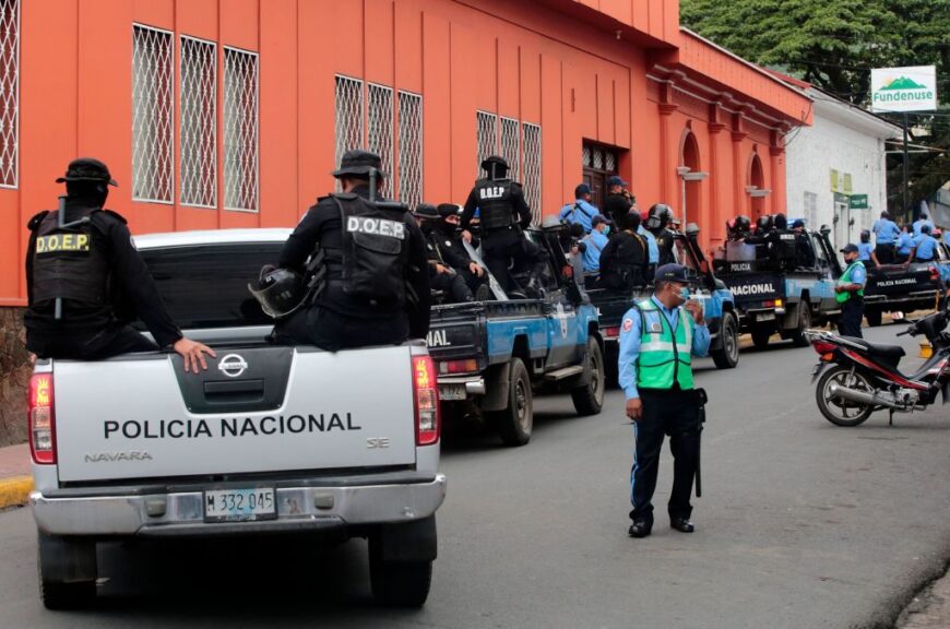 Police officers and riot police patrol outside Matagalpa's Archbishop Curia preventing Monsignor Rolando Alvarez from leaving, in Matagalpa, Nicaragua, on August 4, 2022. - Riot police on Thursday prevented Nicaraguan Bishop, Rolando Alvarez, from leaving the church building to preside at a mass as part of a "prayer crusade" being carried out by the church, following the closure of several Catholic media outlets and allegations of harassment. (Photo by AFP) (Photo by STR/AFP via Getty Images)