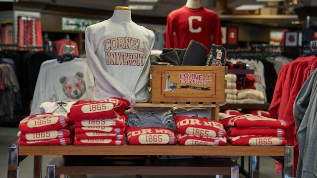 Merchandise for sale inside the Cornell Store at the Cornell University campus in Ithaca, US, on Tuesday, April 11, 2023. US college costs just keep climbing and the increase is pushing the annual price for the upcoming academic year at Ivy League schools toward yet another hold-on-to-your-mortarboard mark. Photographer: Bing Guan/Bloomberg via Getty Images