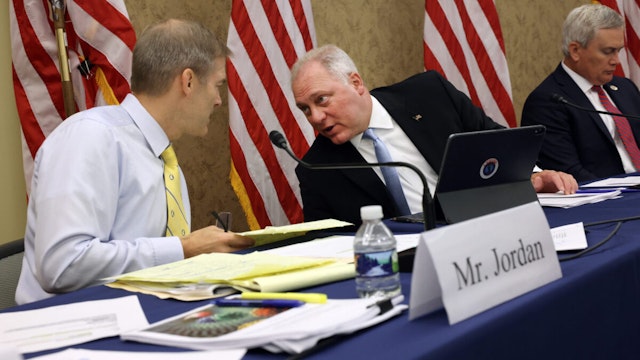 U.S. Rep. Steve Scalise (R) (R-LA) talks to U.S. Rep. Jim Jordan (R-OH) during a Republican-led forum on the origins of the COVID-19 virus at the U.S. Capitol on June 29, 2021 in Washington, DC.