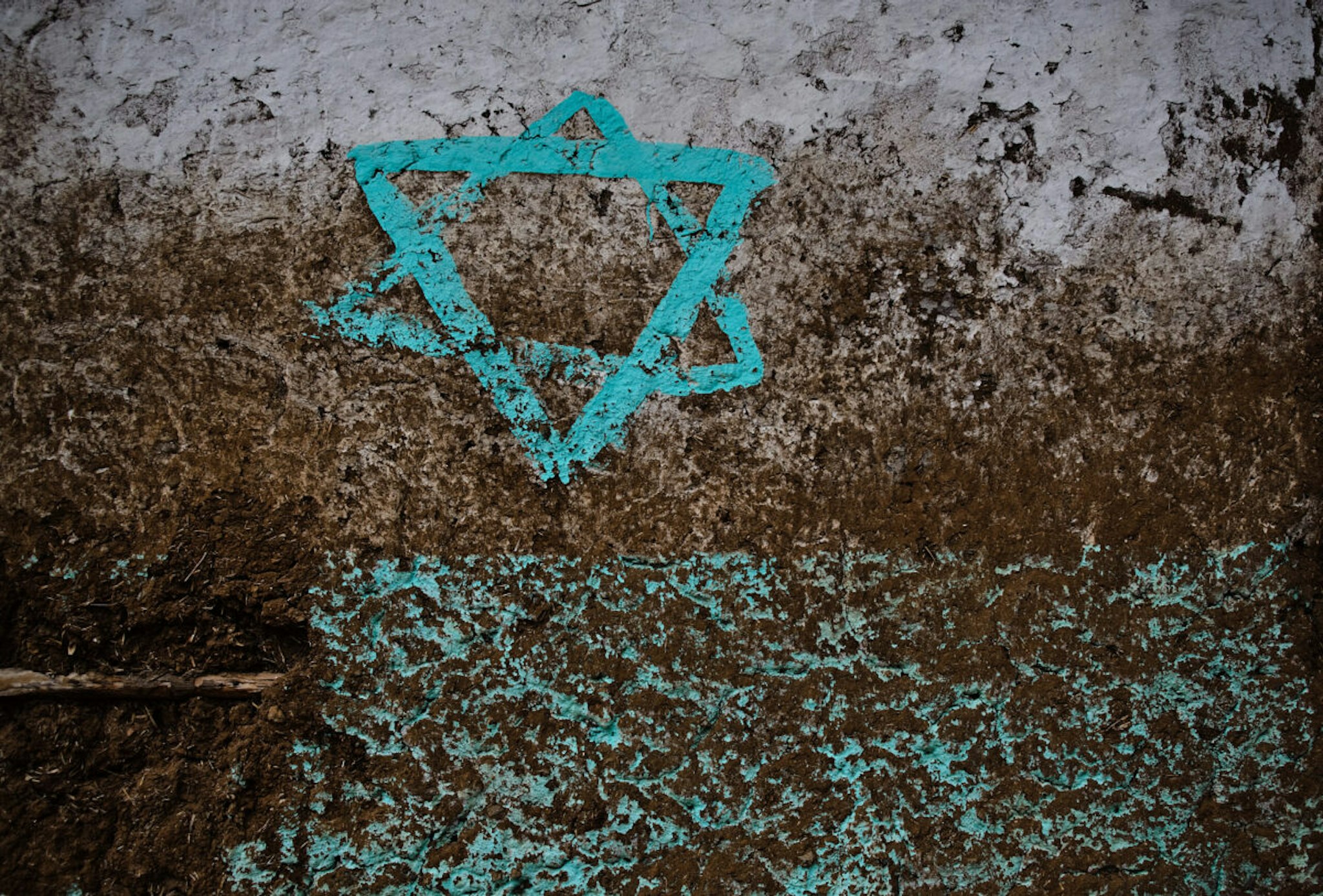 The star of David is painted on the wall of a house formerly inhabited by a jew family. The house is located in the village of Wolleka near Gonder where Ethiopian jews ( falasha) were living till they migrated to Israel. Almost 100.000 falasha have left Ethiopia to Israel, most of them have migrated between 1981 and 2012.