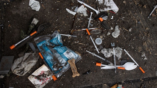 NEW YORK, NEW YORK - SEPTEMBER 22: Used needles are seen on the street during a city sweep of a homeless encampment, September 22, 2022 in New York City, New York. (Photo by Andrew Lichtenstein/Corbis via Getty Images)