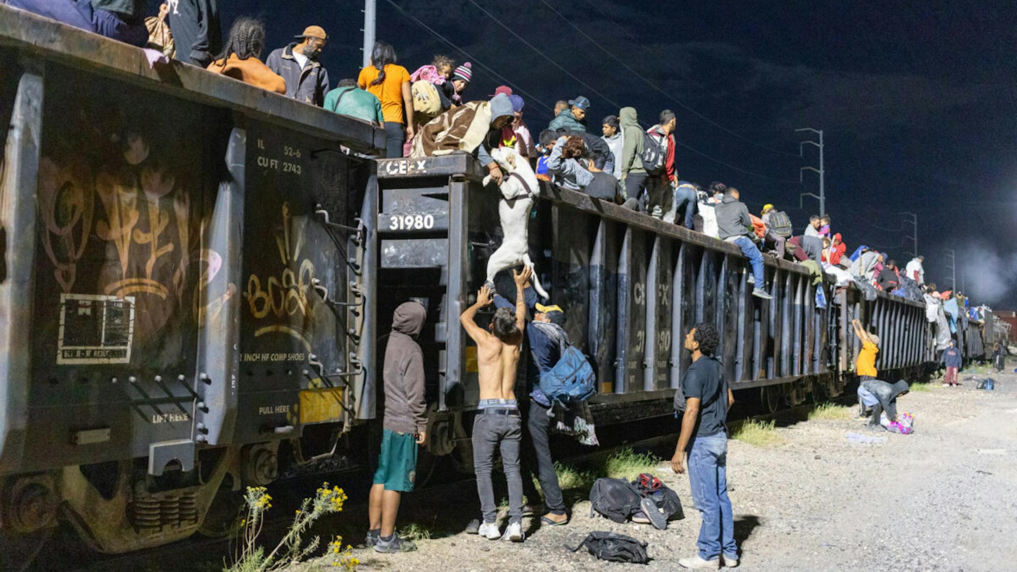 Migrants navigate challenges on their way to the U.S. border CHIHUAHUA - MEXCO - SEPTEMBER 29: Migrant people, mostly from Venezuela, are seen after the goods train they were travelling on stopped for over 12 hours, in the Chihuahuan desert in Chihuahuan, Mexico on September 29, 2023.