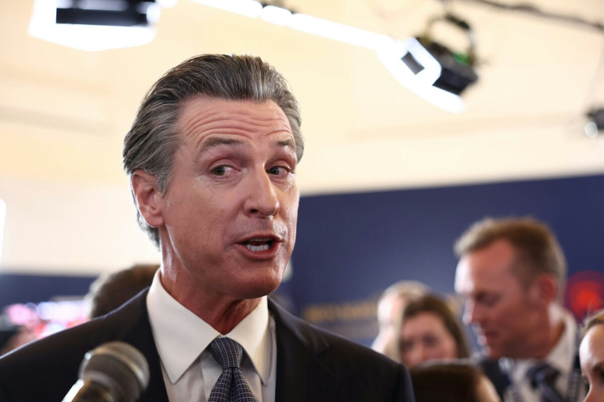 California Gov. Gavin Newsom talks to reporters in the spin room following the FOX Business Republican Primary Debate at the Ronald Reagan Presidential Library on September 27, 2023 in Simi Valley, California.