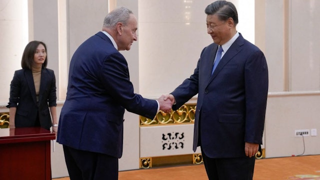 US Senate Majority Leader Chuck Schumer (L) is greeted by Chinese President Xi Jinping before their bilateral meeting at the Great Hall of the People in Beijing on October 9, 2023. (Photo by Andy Wong / POOL / AFP)