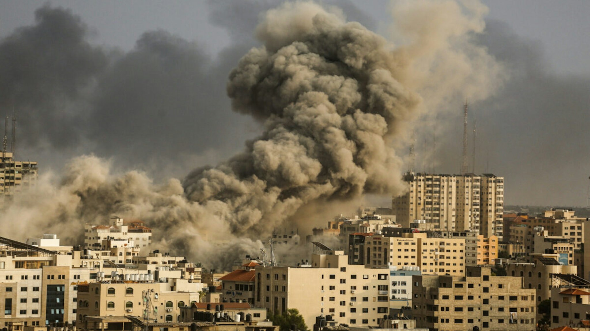 A smoke rises over a buildings in Gaza City on October 9, 2023 during an Israeli air strike.