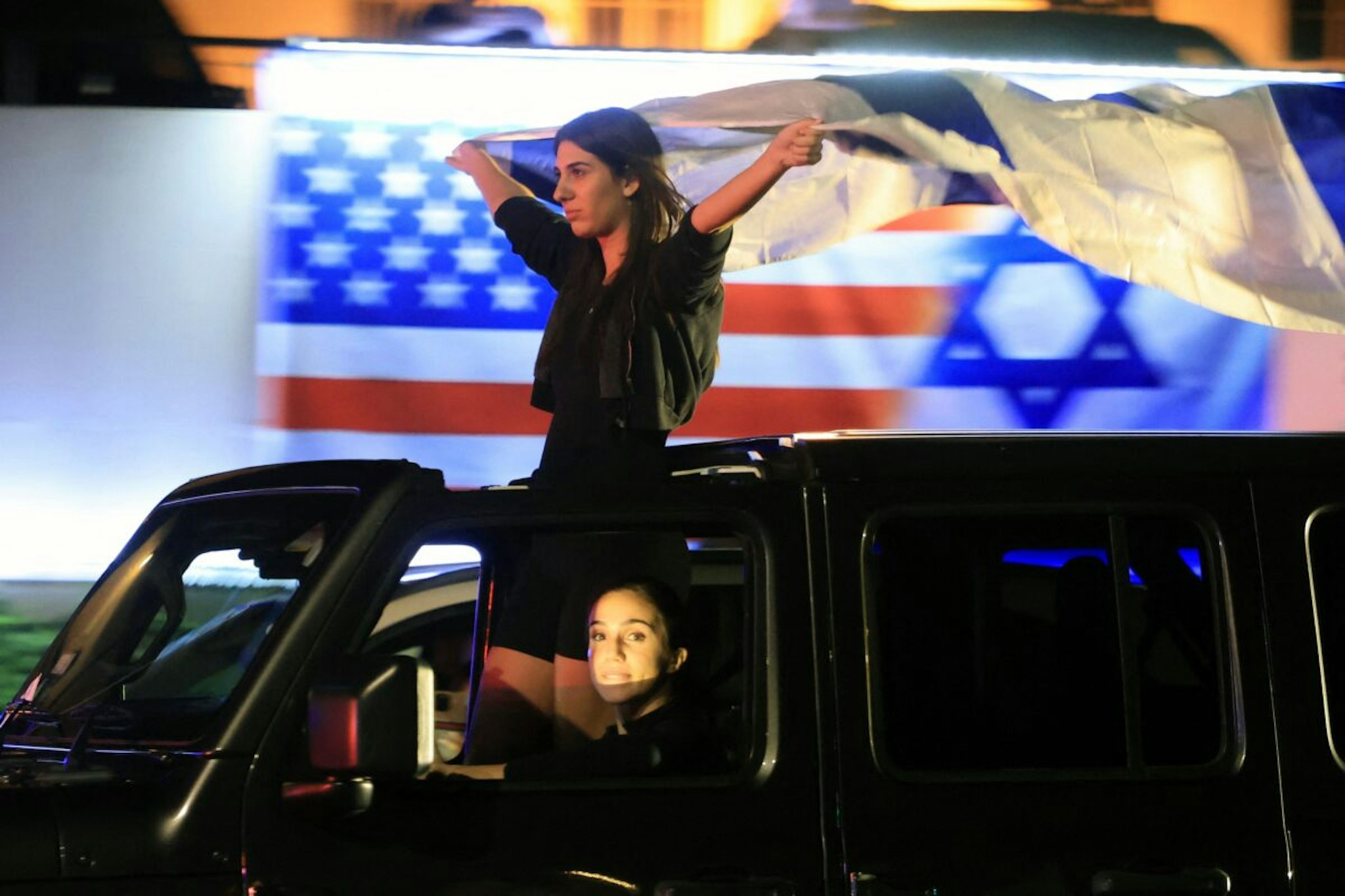 Supporters of Israel demonstrate with national flags in Beverly Hills, California on October 9, 2023, after the Palestinian militant group Hamas launched an attack on Israel.