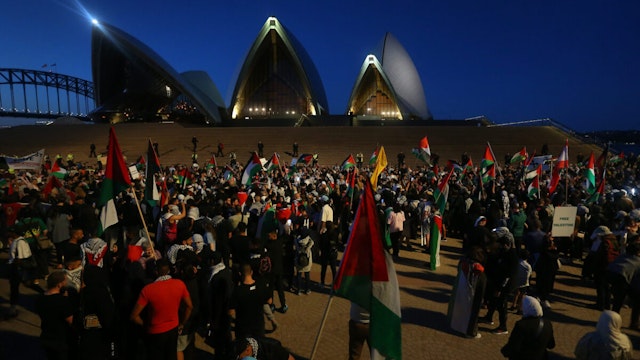 SYDNEY, AUSTRALIA - OCTOBER 09: Palestine supporters rally outside the Sydney Opera House on October 09, 2023 in Sydney, Australia. The Palestinian militant group Hamas launched a surprise attack on Israel from Gaza by land, sea, and air, over the weekend, killing over 600 people and wounding more than 2000, agency reports said. Reports also said Israeli soldiers and civilians have been kidnapped by Hamas and taken into Gaza. The attack prompted a declaration of war by Israeli Prime Minister Benjamin Netanyahu, and ongoing retaliatory strikes by Israel on Gaza killing hundreds in the aftermath.