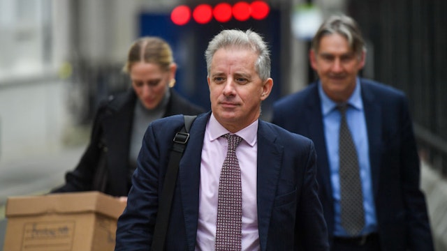 Christopher Steele, ex-MI6 agent, centre, departs from the Royal Courts of Justice in London, UK, on Monday, Oct. 16, 2023. Former US President Donald Trump kicked off his data collection suit in a London court against Steele's Orbis business intelligence firm on Monday, saying he'd suffered "significant damage and distress" from the publication of the dossier that alleged ties between the Kremlin and the former US president's successful run to the White House.