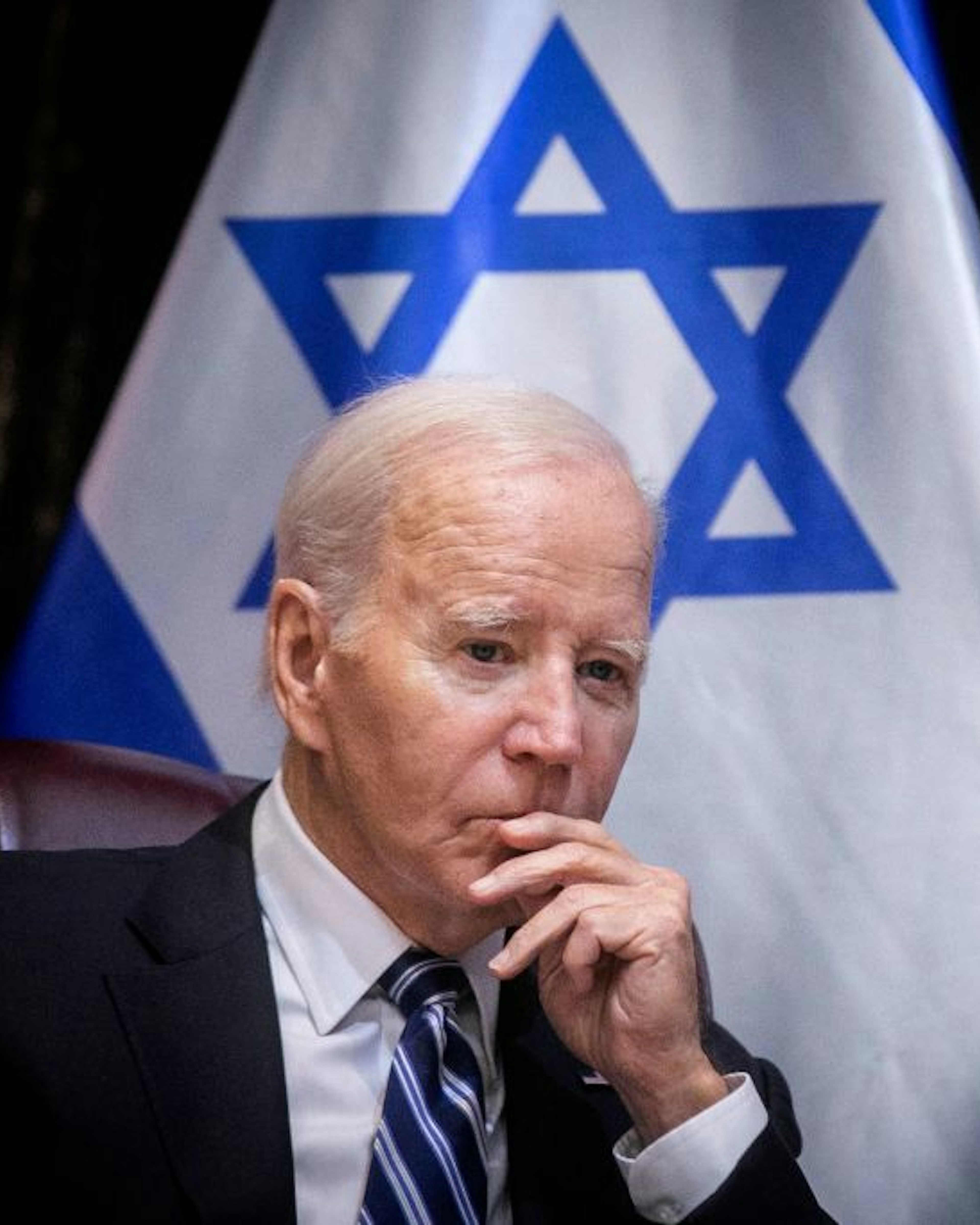 TOPSHOT - US President Joe Biden joins Israel's Prime Minister for the start of the Israeli war cabinet meeting, in Tel Aviv on October 18, 2023, amid the ongoing battles between Israel and the Palestinian group Hamas. US President Joe Biden landed in Tel Aviv on October 18, 2023 as Middle East anger flared after hundreds were killed when a rocket struck a hospital in war-torn Gaza, with Israel and the Palestinians quick to trade blame. (Photo by Miriam Alster / POOL / AFP) (Photo by MIRIAM ALSTER/POOL/AFP via Getty Images)