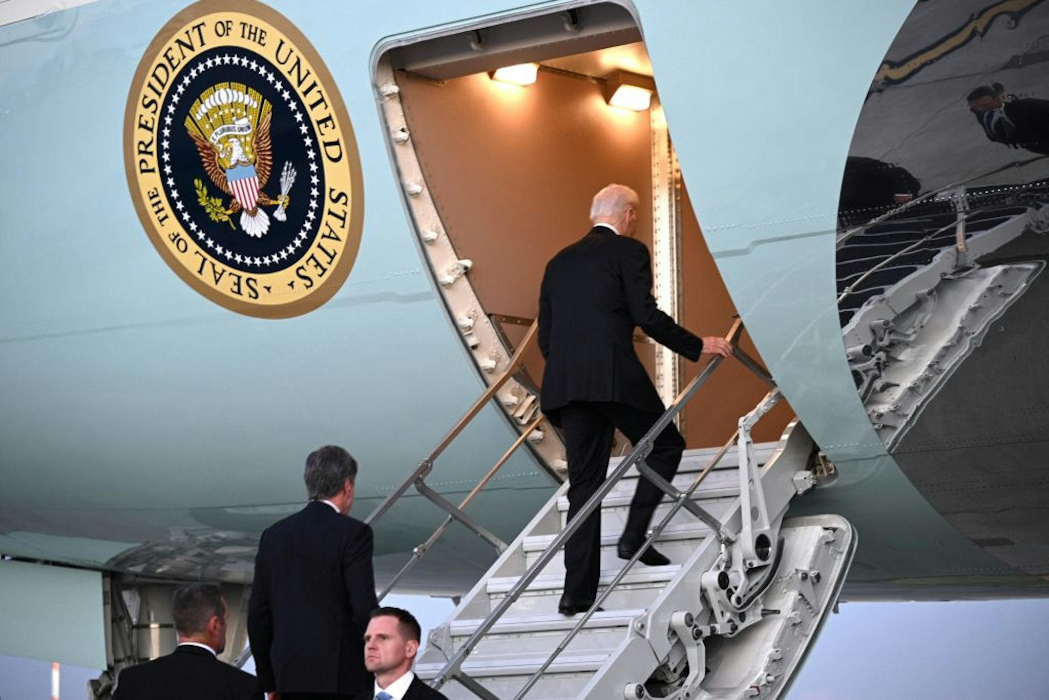 US President Joe Biden boards Air Force One at Ben Gurion International Airport following a solidarity visit to Israel, on October 18, 2023, amid the ongoing battles between Israel and the Palestinian group Hamas in the Gaza Strip. Thousands of people, both Israeli and Palestinians have died since October 7, 2023, after Palestinian Hamas militants based in the Gaza Strip, entered southern Israel in a surprise attack leading Israel to declare war on Hamas in Gaza on October 8. (Photo by Brendan SMIALOWSKI / AFP) (Photo by BRENDAN SMIALOWSKI/AFP via Getty Images)