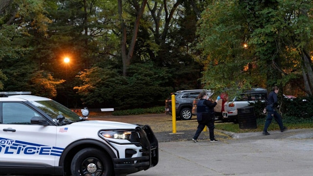 Detroit police officers work near the scene where Isaac Agree Downtown Synagogue president, Samantha Woll, was found dead in Detroit, October 21, 2023.