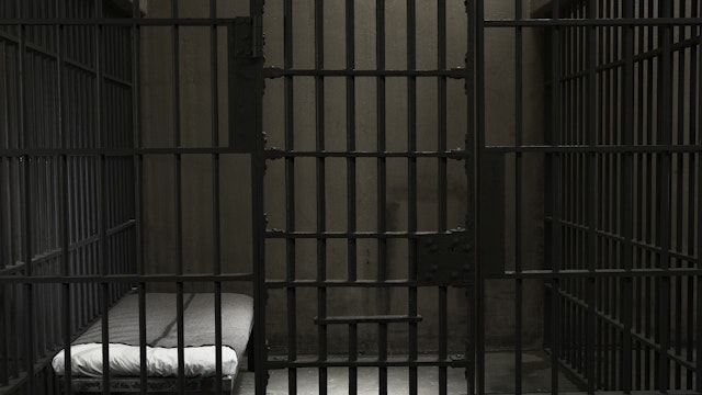 Empty prison cell - stock photo