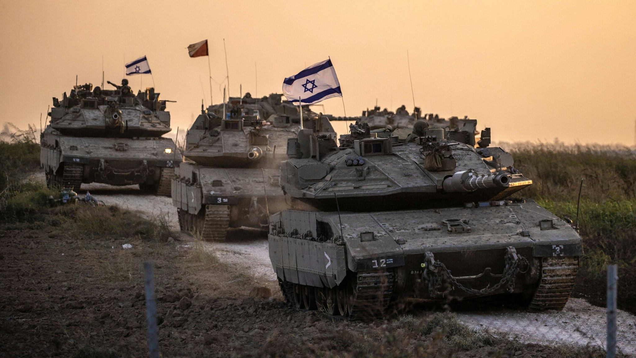 ISRAEL - OCTOBER 12: Israeli tanks move near Gaza border as Israeli army deploys military vehicles around the Gaza Strip, Israel on October 12, 2023.