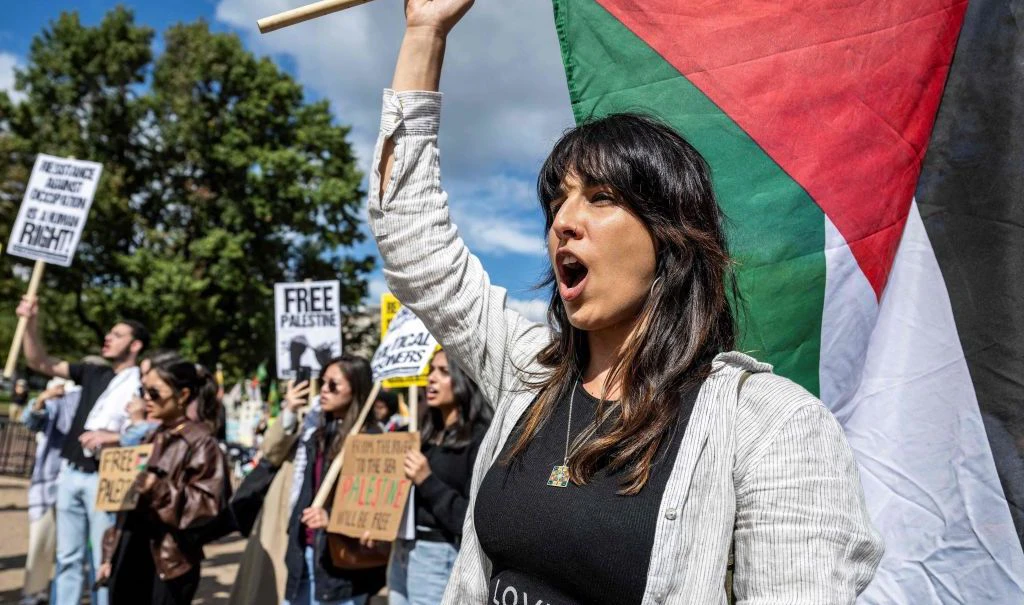 Demonstrators chant slogans outside the White House in Washington, DC, on October 8, 2023 as crowds rally in support of Palestinians after the Palestinian militant group Hamas launched an assault on Israel. Israel, reeling from the deadliest attack in half a century, formally declared war on Hamas Sunday as the conflict's death toll surged above 1,000 after the Palestinian militant group launched a massive surprise assault from Gaza. (Photo by Jim WATSON / AFP) (Photo by JIM WATSON/AFP via Getty Images)