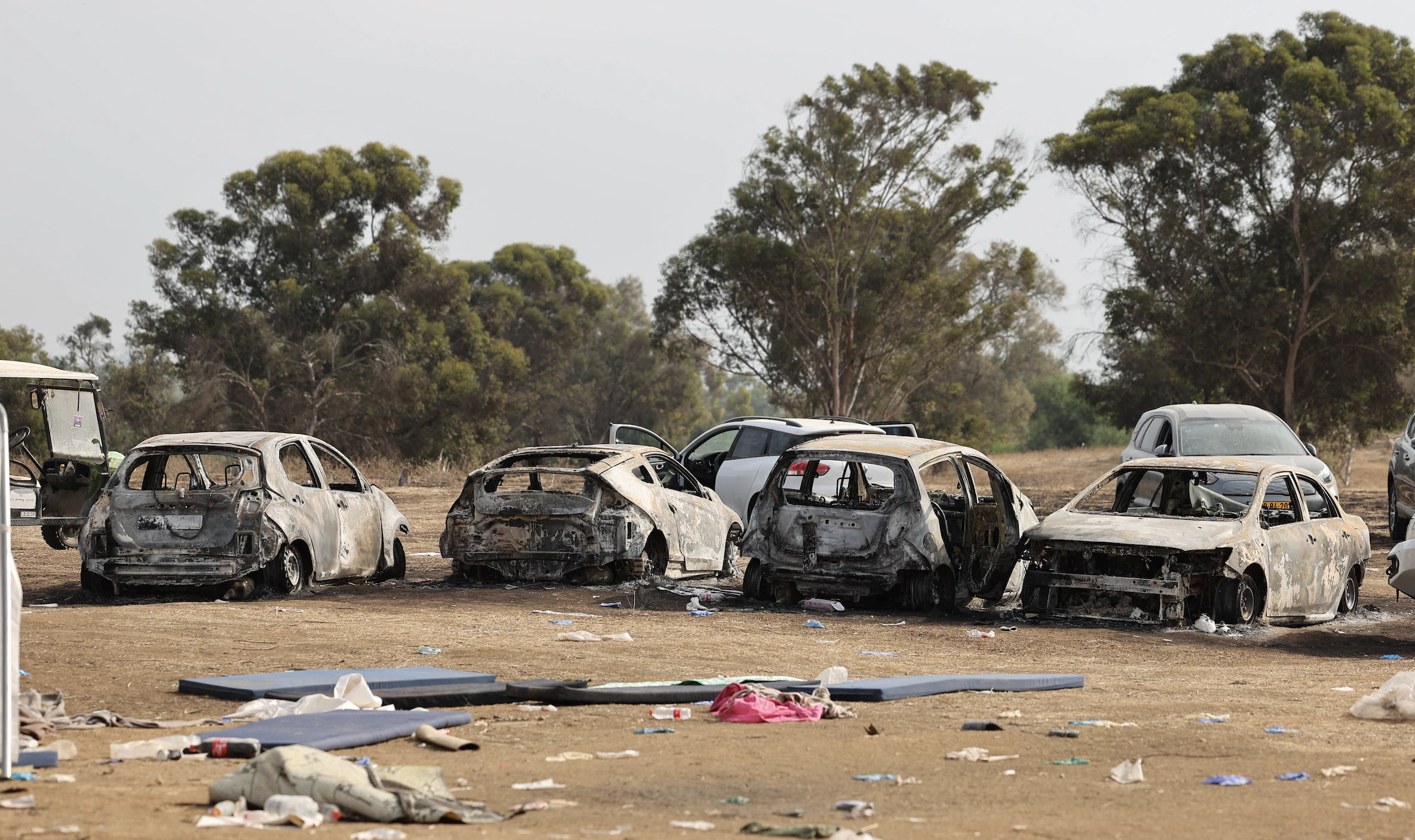 Burnt vehicles are left behind at the site of the weekend attack on the Supernova desert music Festival by Palestinian militants near Kibbutz Reim in the Negev desert in southern Israel on October 10, 2023. Hamas gunmen killed around 270 revellers who were attending an outdoor rave music festival in an Israeli community near Gaza at the weekend, a volunteer who helped collect the bodies said on October 9.